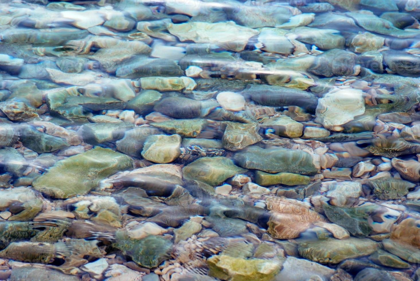 Stones in sea water photo