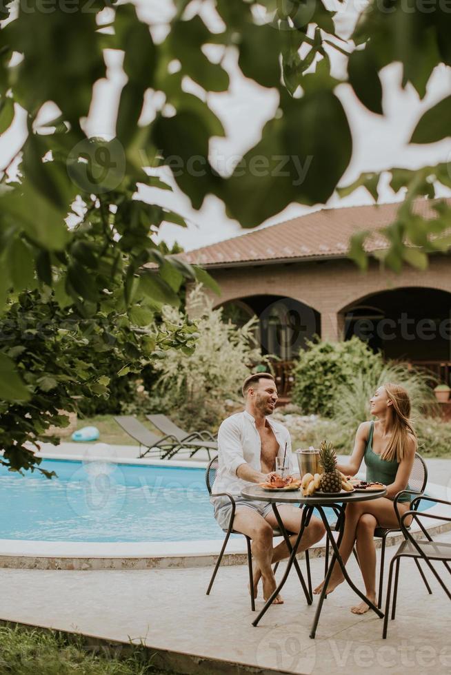Young couple sitting in the backyard photo