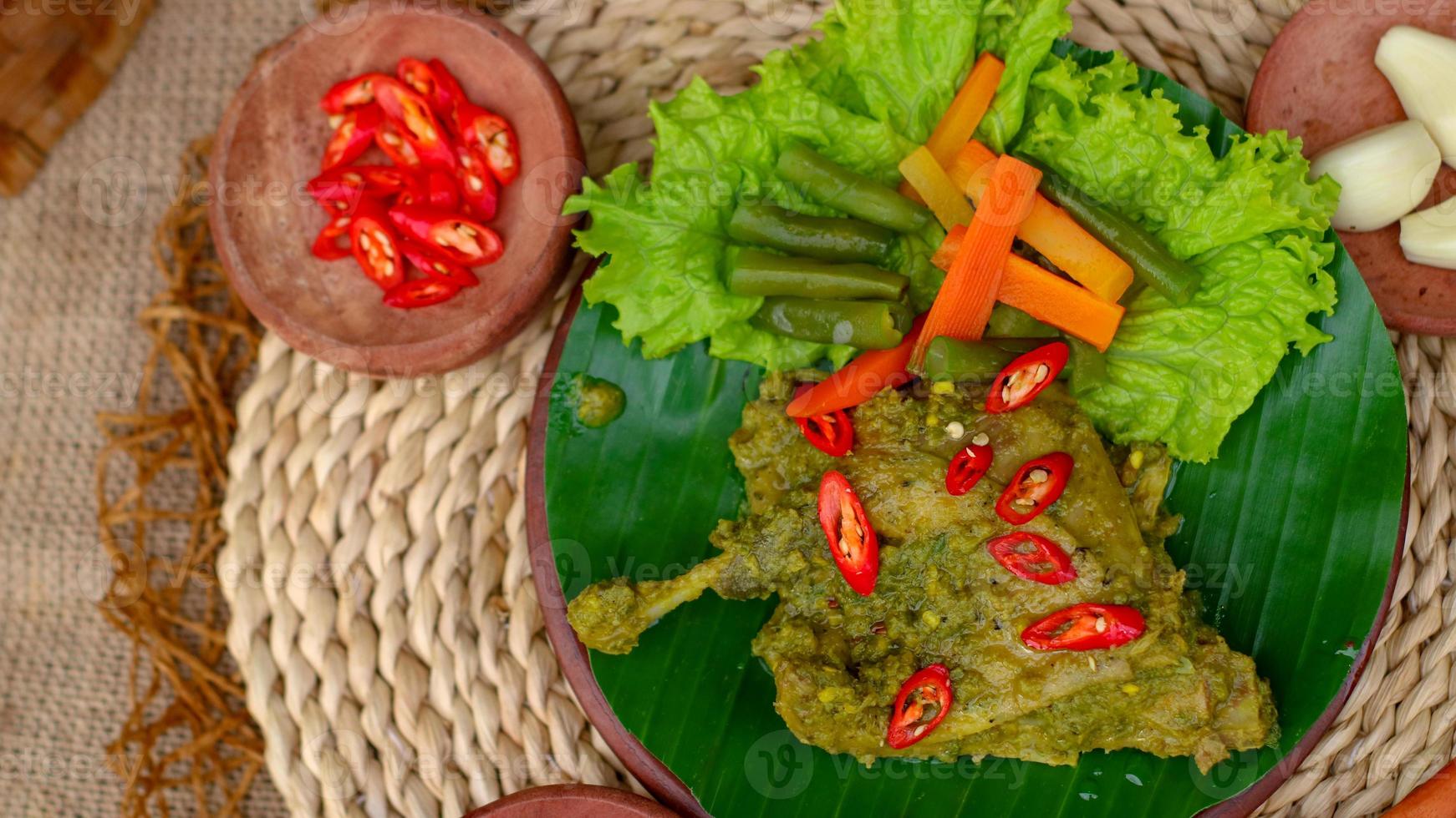 duck food with green chili complete with spices photo