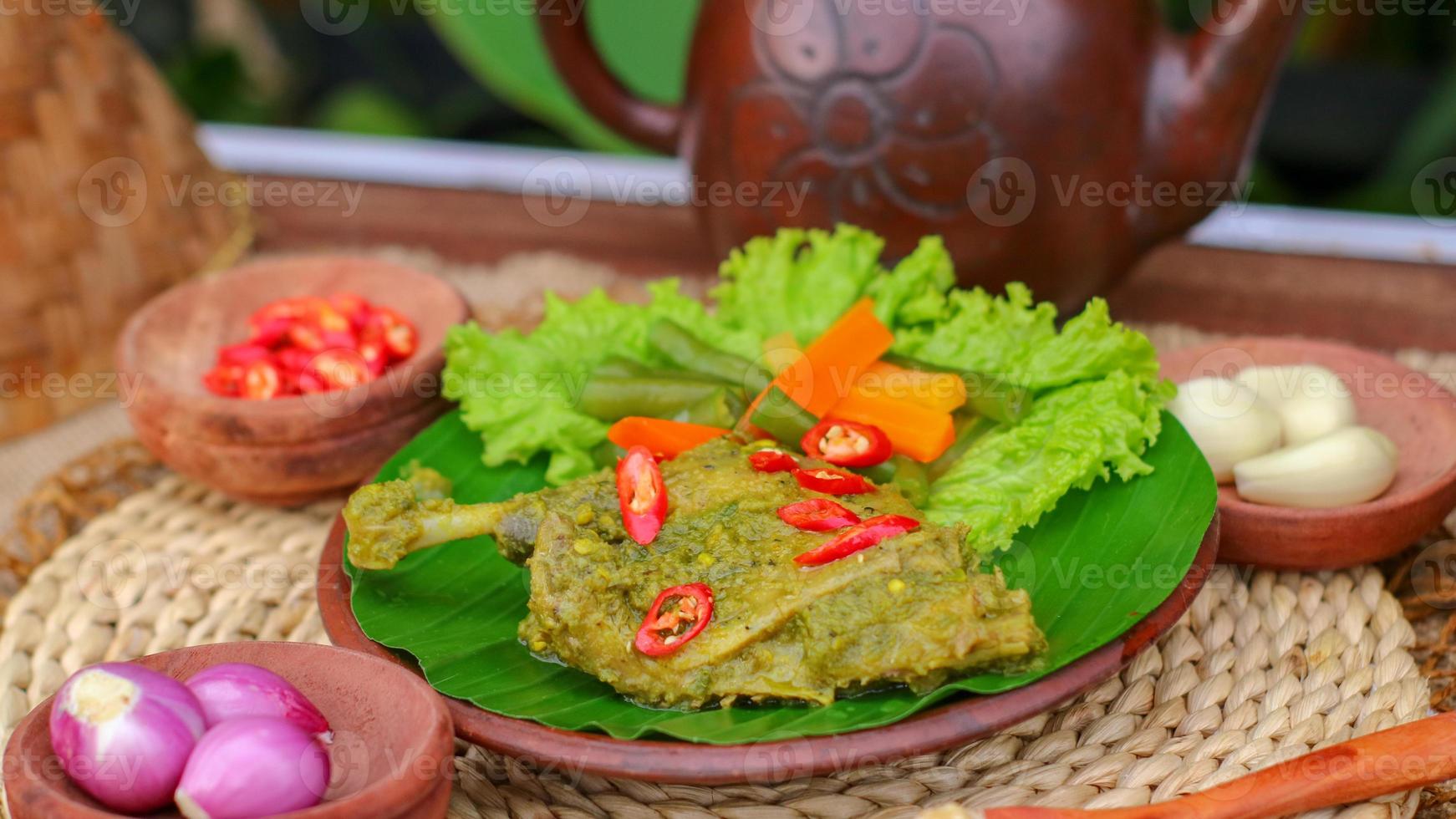 duck food with green chili complete with spices photo