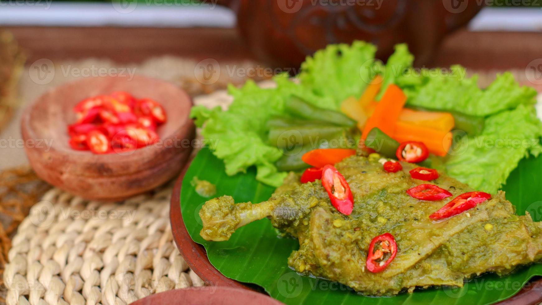 duck food with green chili complete with spices photo