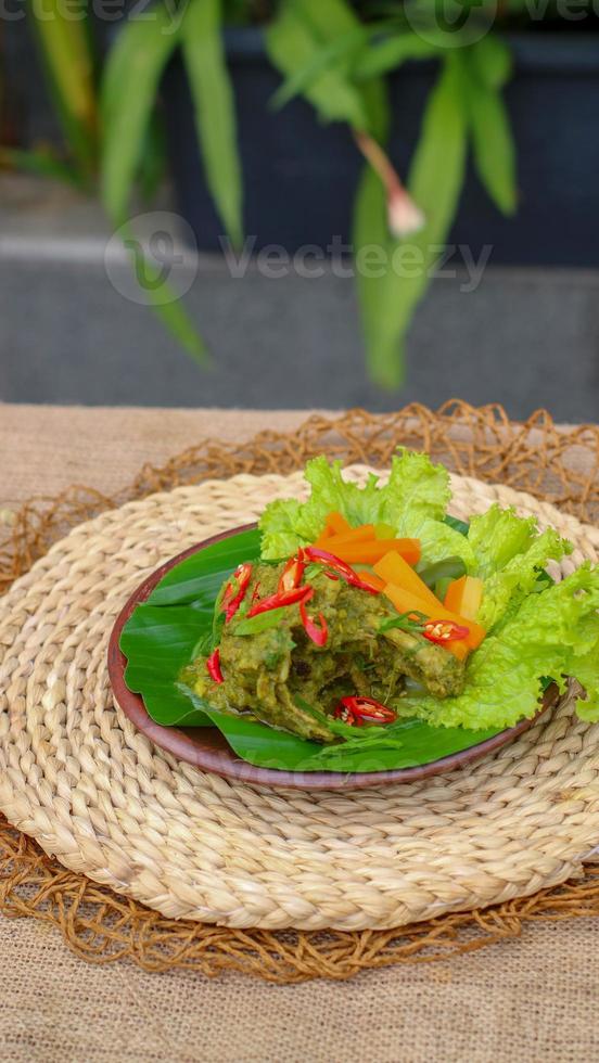 duck food with green chili complete with spices photo