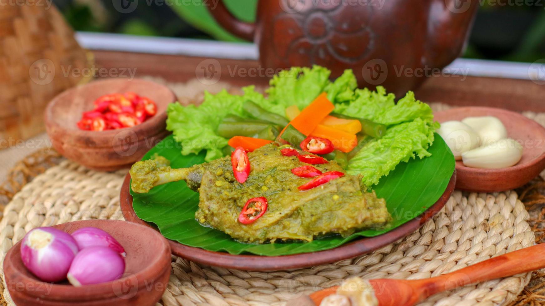 duck food with green chili complete with spices photo