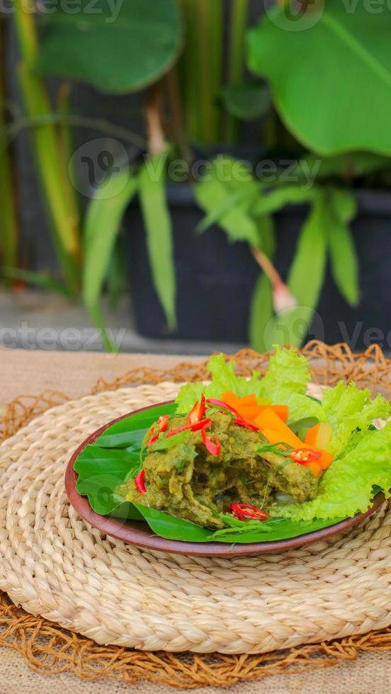 duck food with green chili complete with spices photo