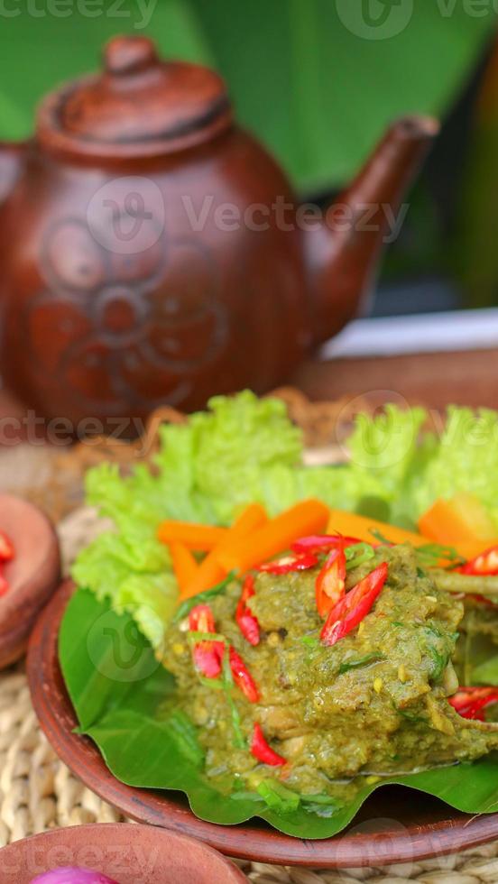 duck food with green chili complete with spices photo