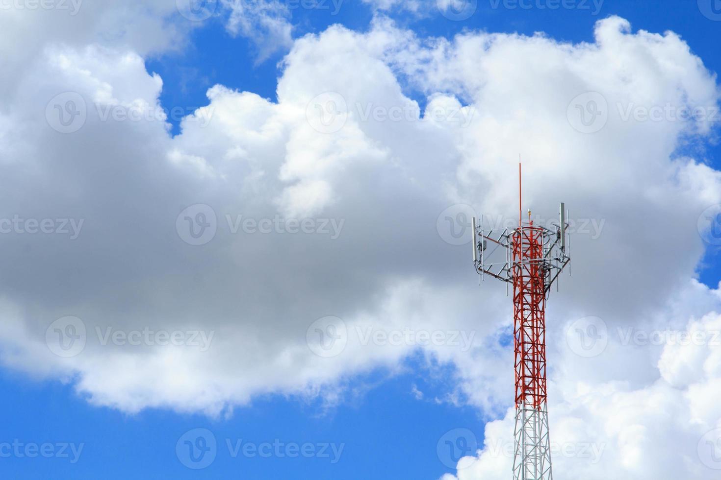 Tall telephone poles are ready to distribute Internet and telephone signals for the public to make full use of them against the background of the beautiful natural afternoon white and blue sky. photo