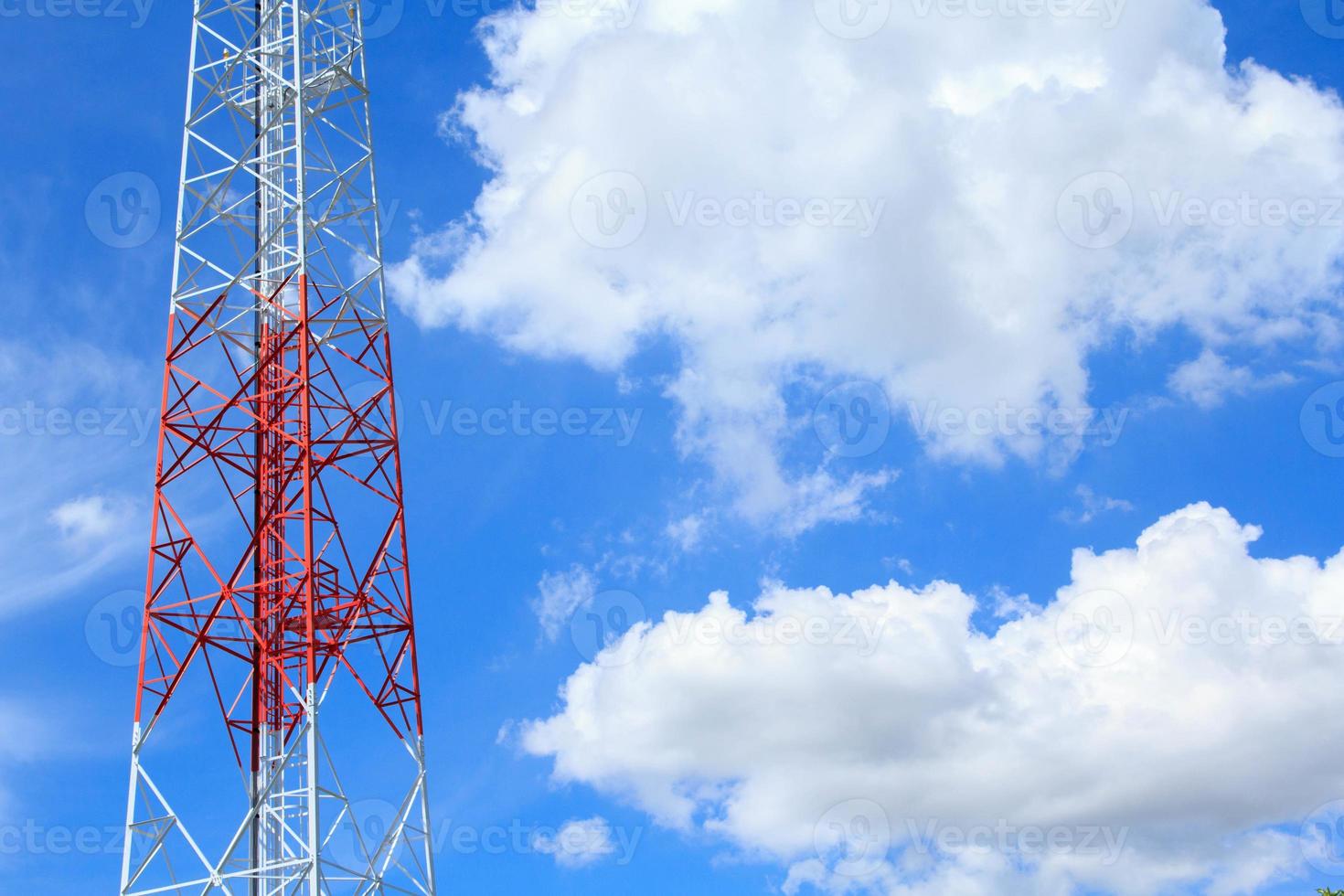 Tall telephone poles are ready to distribute Internet and telephone signals for the public to make full use of them against the background of the beautiful natural afternoon white and blue sky. photo