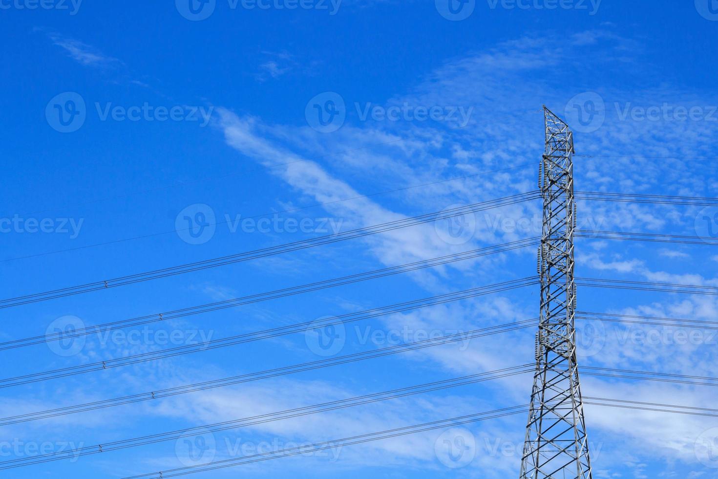 High voltage poles designed by engineers for industrial plants and consumer home power on blue and warm sky background is modern technology and modern industrial and dangerous, please do not approach. photo