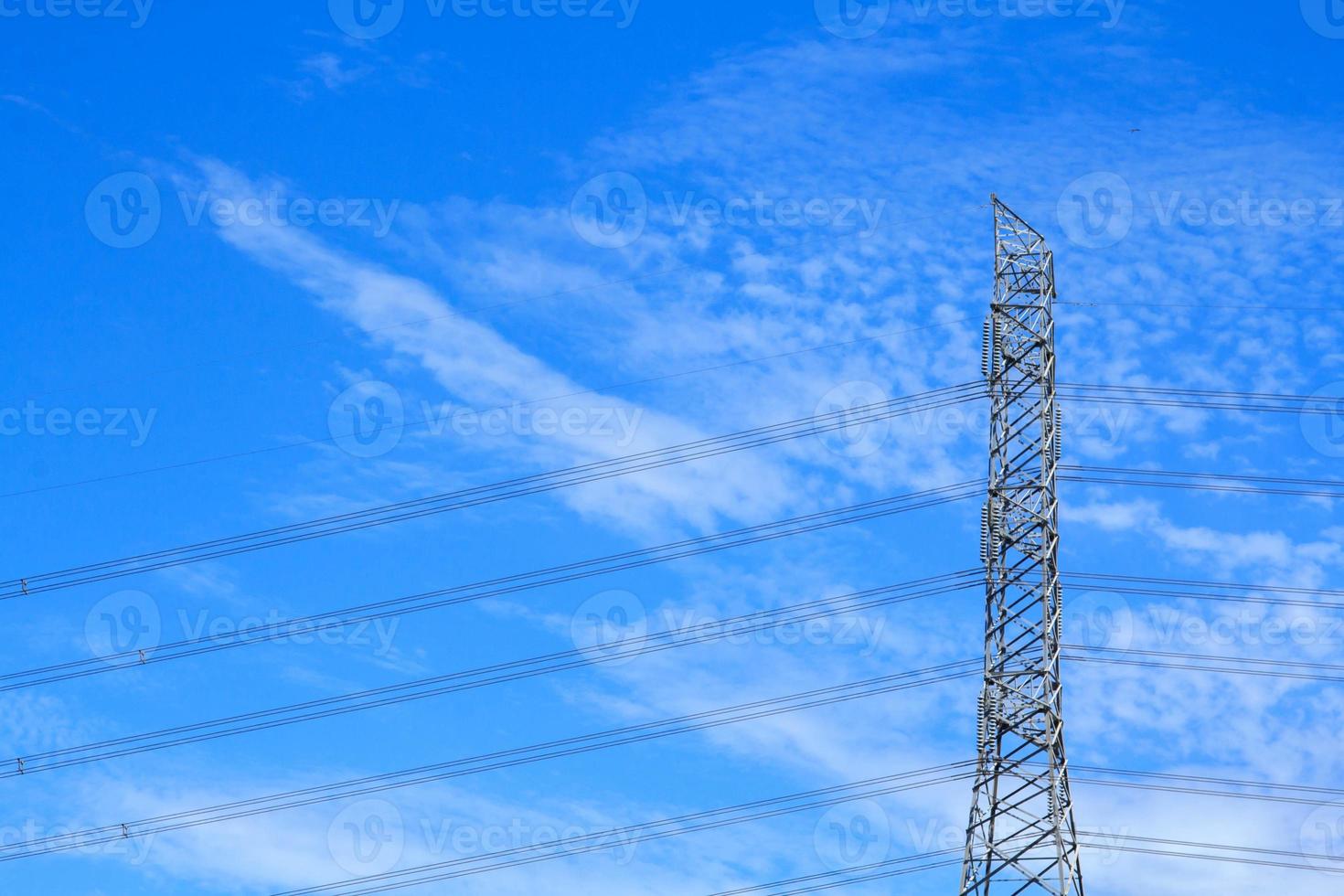 High voltage poles designed by engineers for industrial plants and consumer home power on blue and warm sky background is modern technology and modern industrial and dangerous, please do not approach. photo