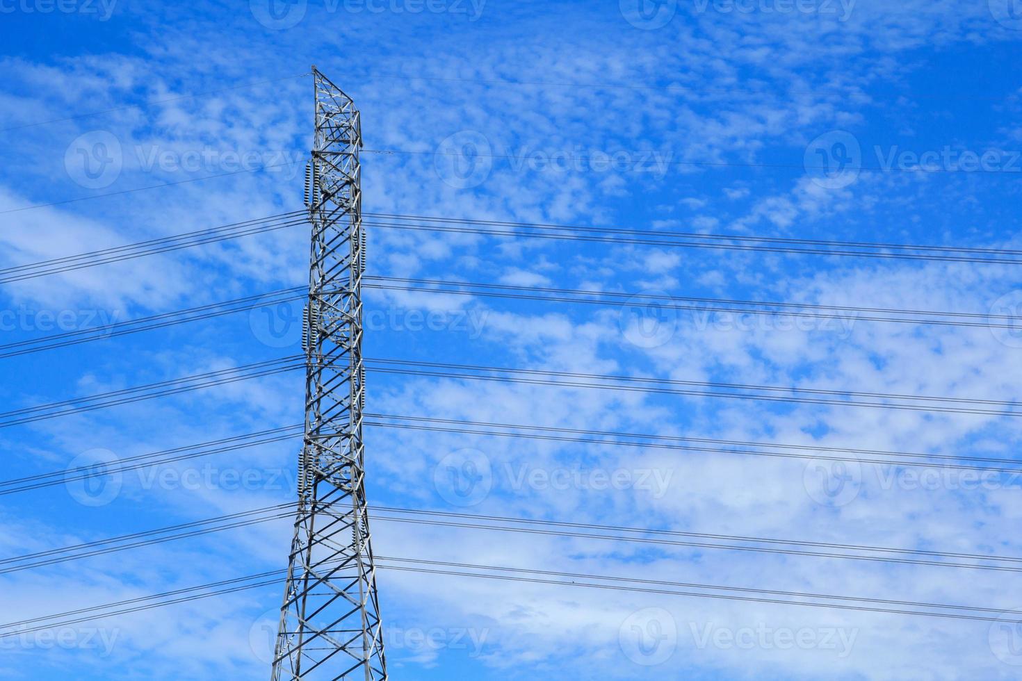 High voltage poles designed by engineers for industrial plants and consumer home power on blue and warm sky background is modern technology and modern industrial and dangerous, please do not approach. photo