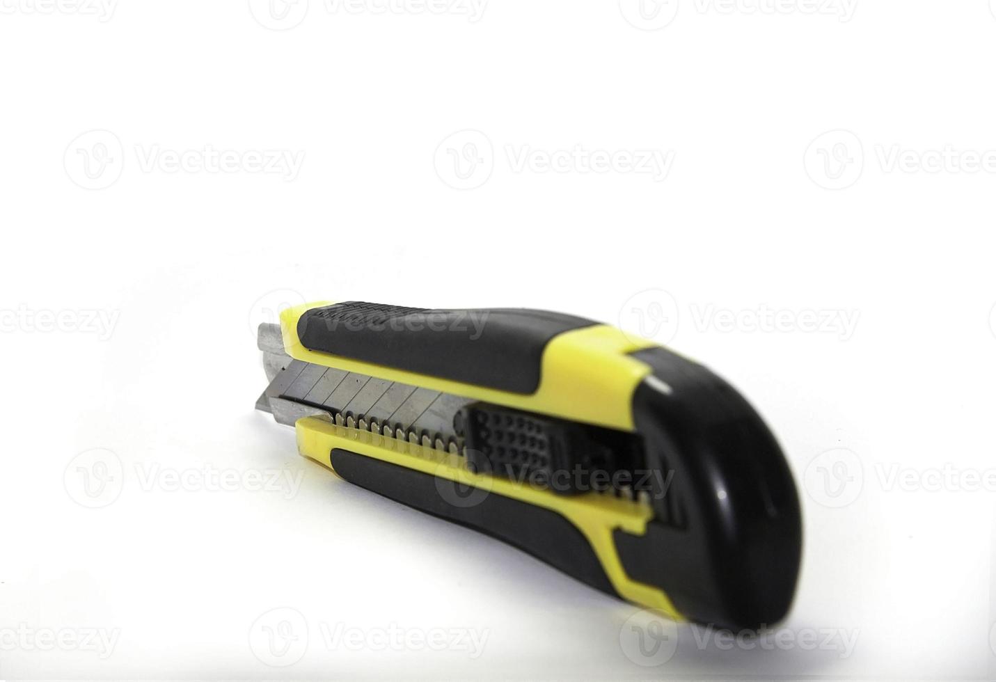 Yellow-Black Cutter Knife Office tools and technician equipment on a white background photo