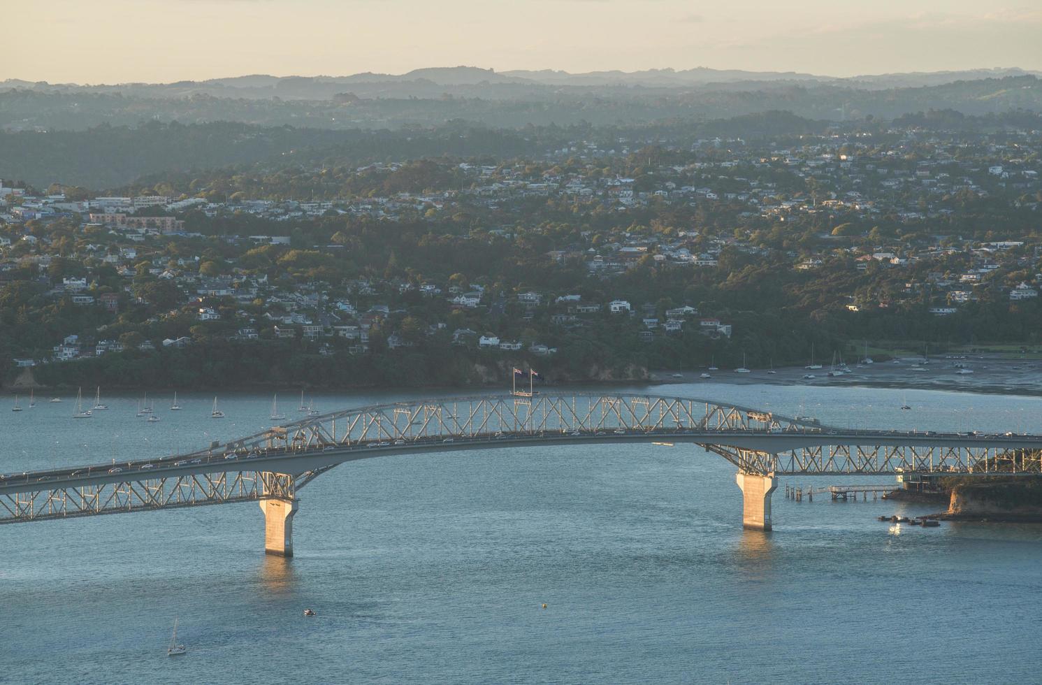 Auckland Harbour Bridge is an eight-lane box truss motorway bridge over the Waitemata Harbour, North Island, Auckland. photo