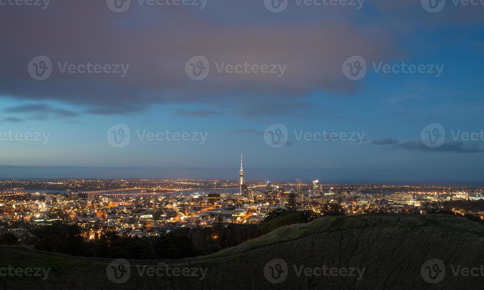 The scenery view of Auckland cityscape at night view from the summit of mount Eden volcano, North Island, New Zealand. photo
