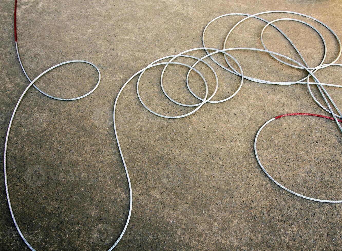 New wire rope cable on concrete floor photo