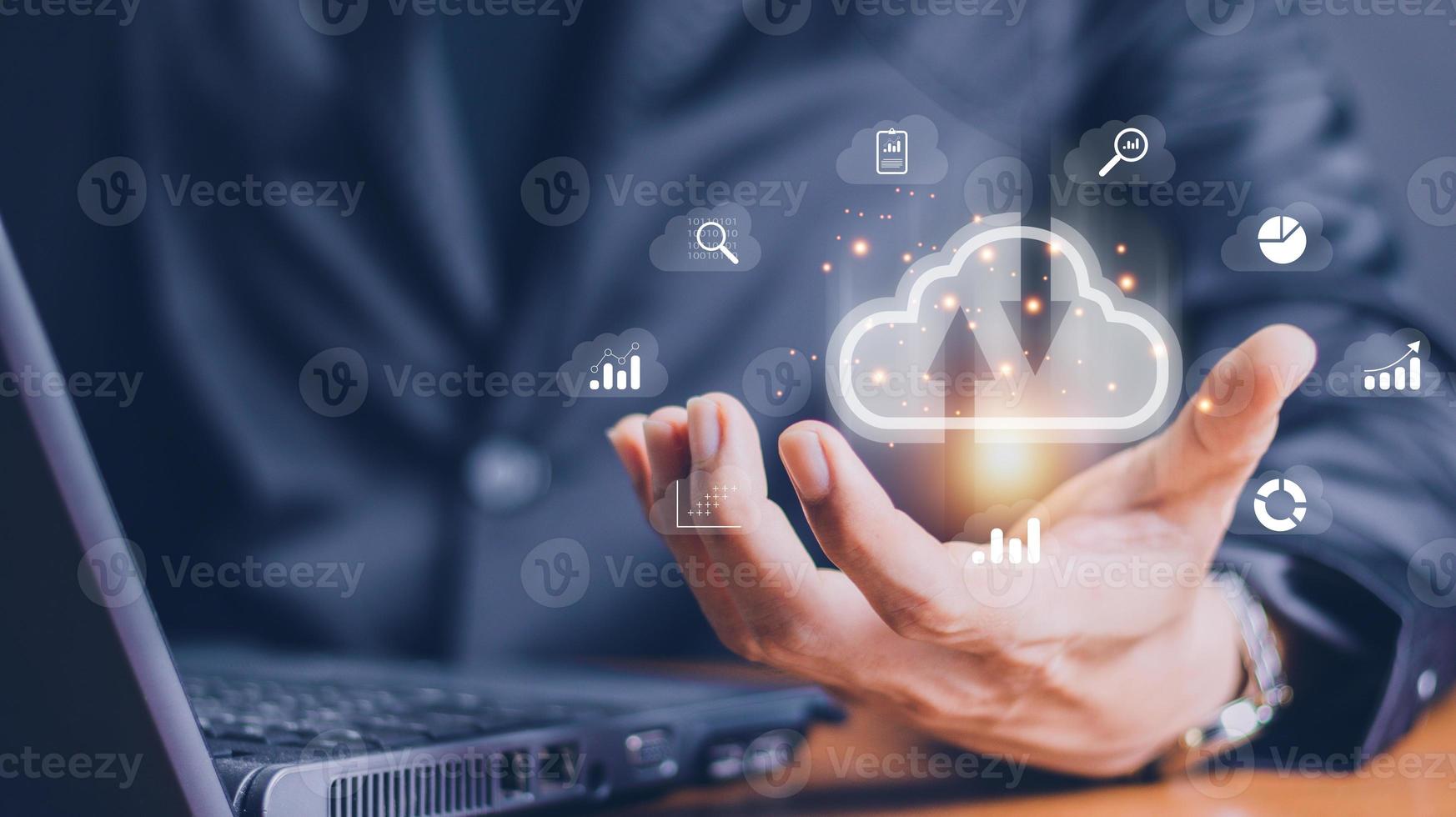 man use Laptop with cloud computing diagram show on hand. Cloud technology. Data storage. Networking and internet service concept. photo
