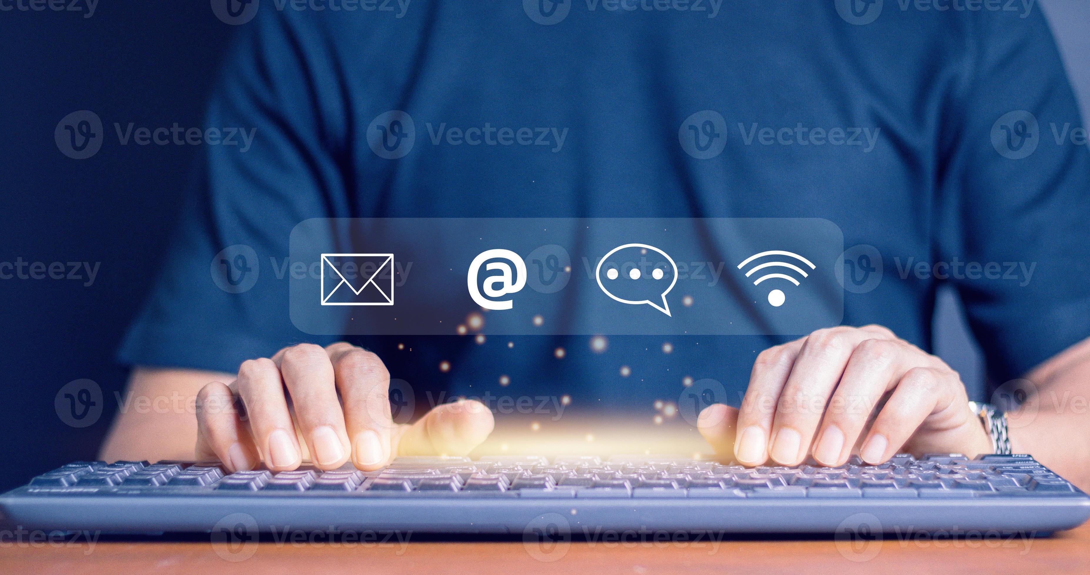 Businessman using computer keyboard with the email, call phone, address