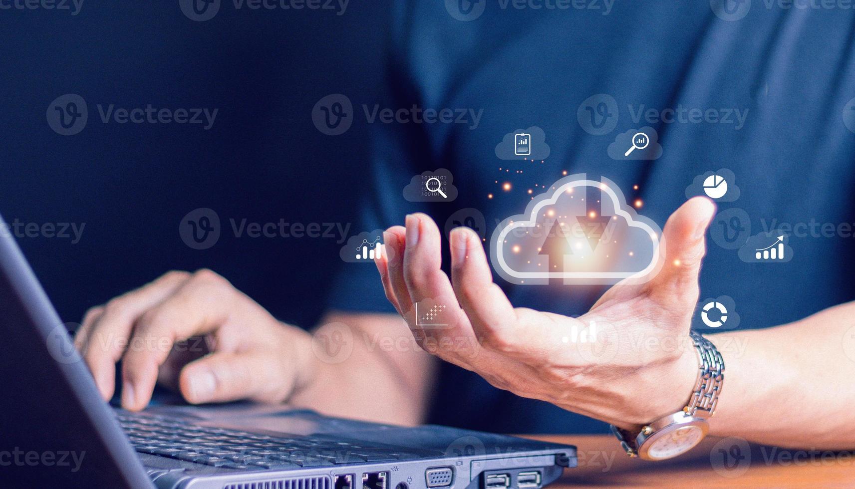 Cloud technology. Data storage. Networking and internet service concept.man use Laptop with cloud computing diagram show on hand. photo