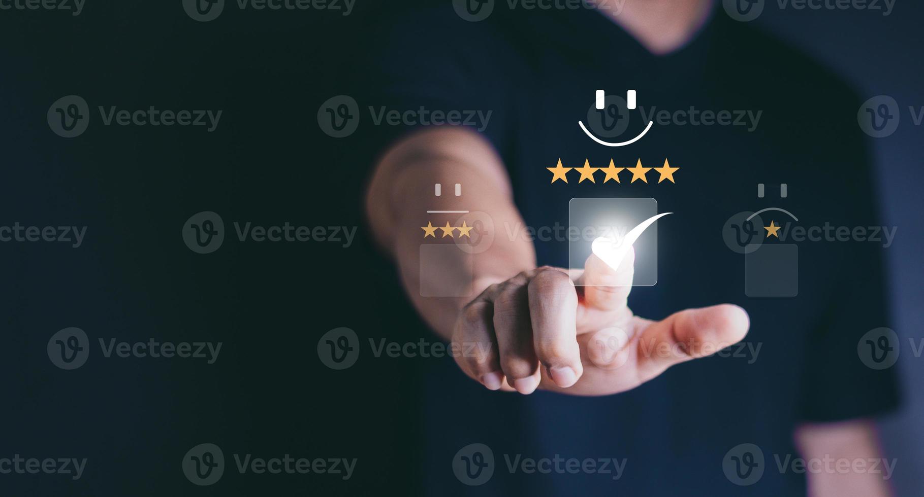 Customer service and Satisfaction concept, Business people touching the virtual screen on the happy Smiley face icon to give satisfaction in service. rating very impressed. photo