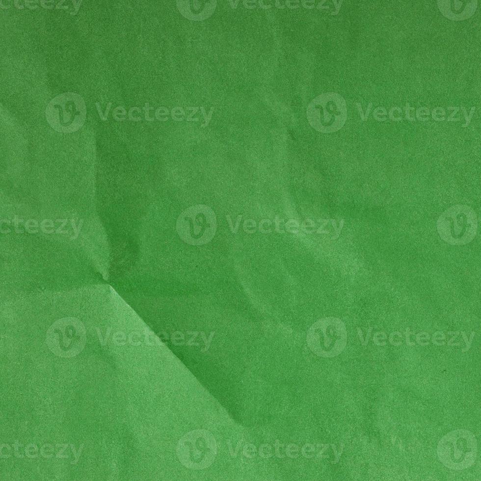 Green crumpled background paper texture. High quality background and copy space for text. photo