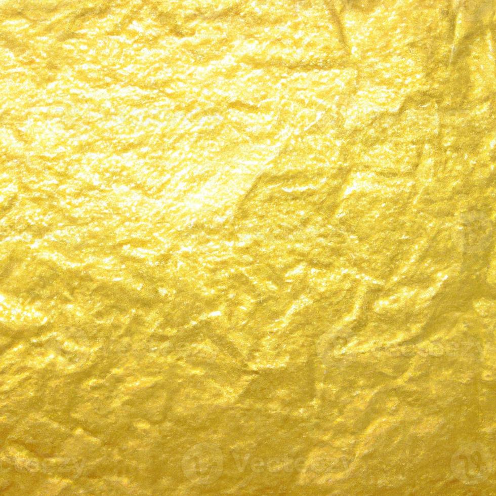 Gold crumpled background paper texture. High quality background and copy space for text. photo