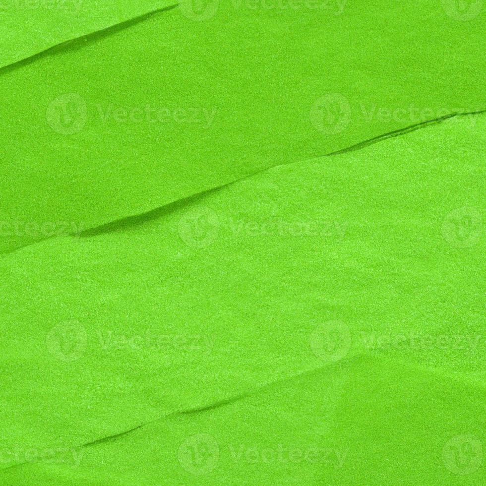Green crumpled background paper texture. High quality background and copy space for text. photo