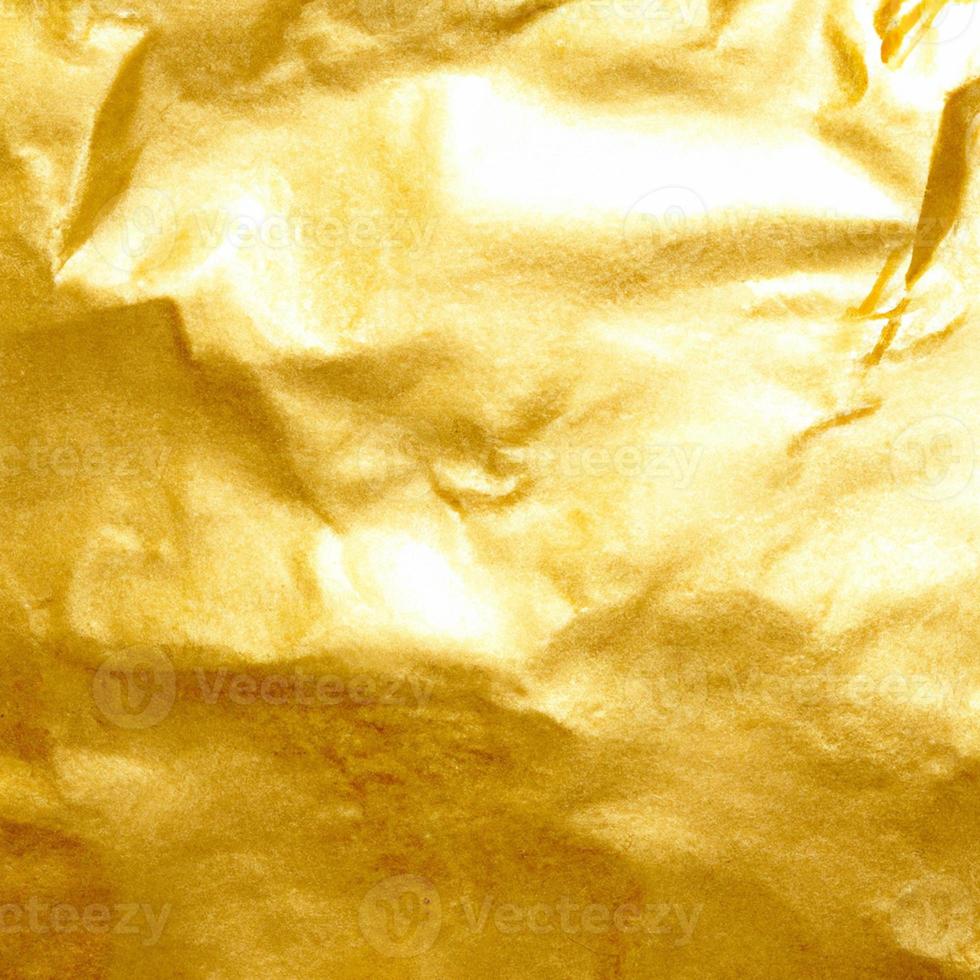 Gold crumpled background paper texture. High quality background and copy space for text. photo