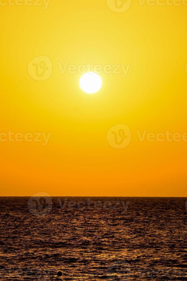 Sunset over the ocean photo