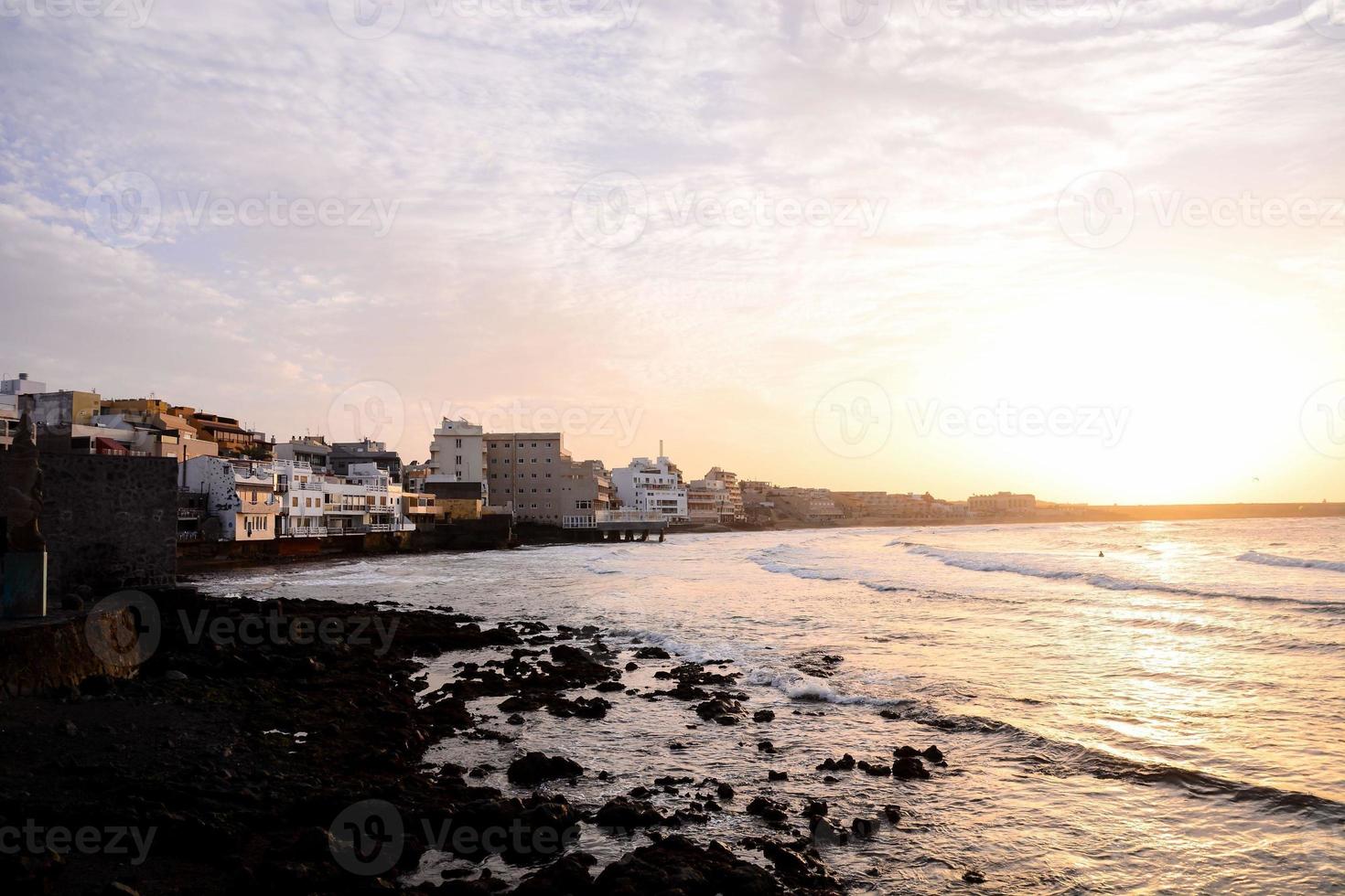 Sunset over the ocean photo
