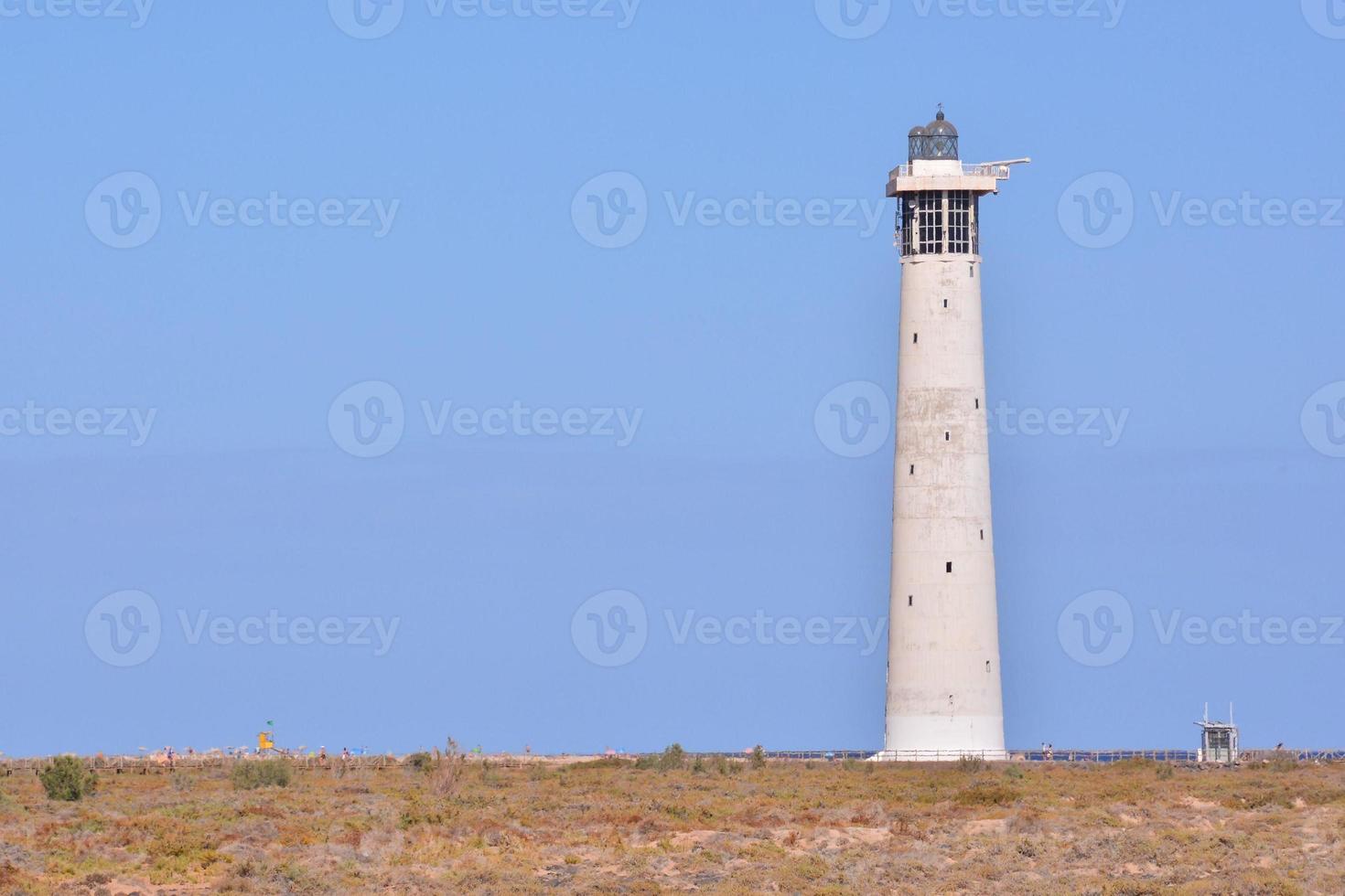 Lighthouse by the sea photo