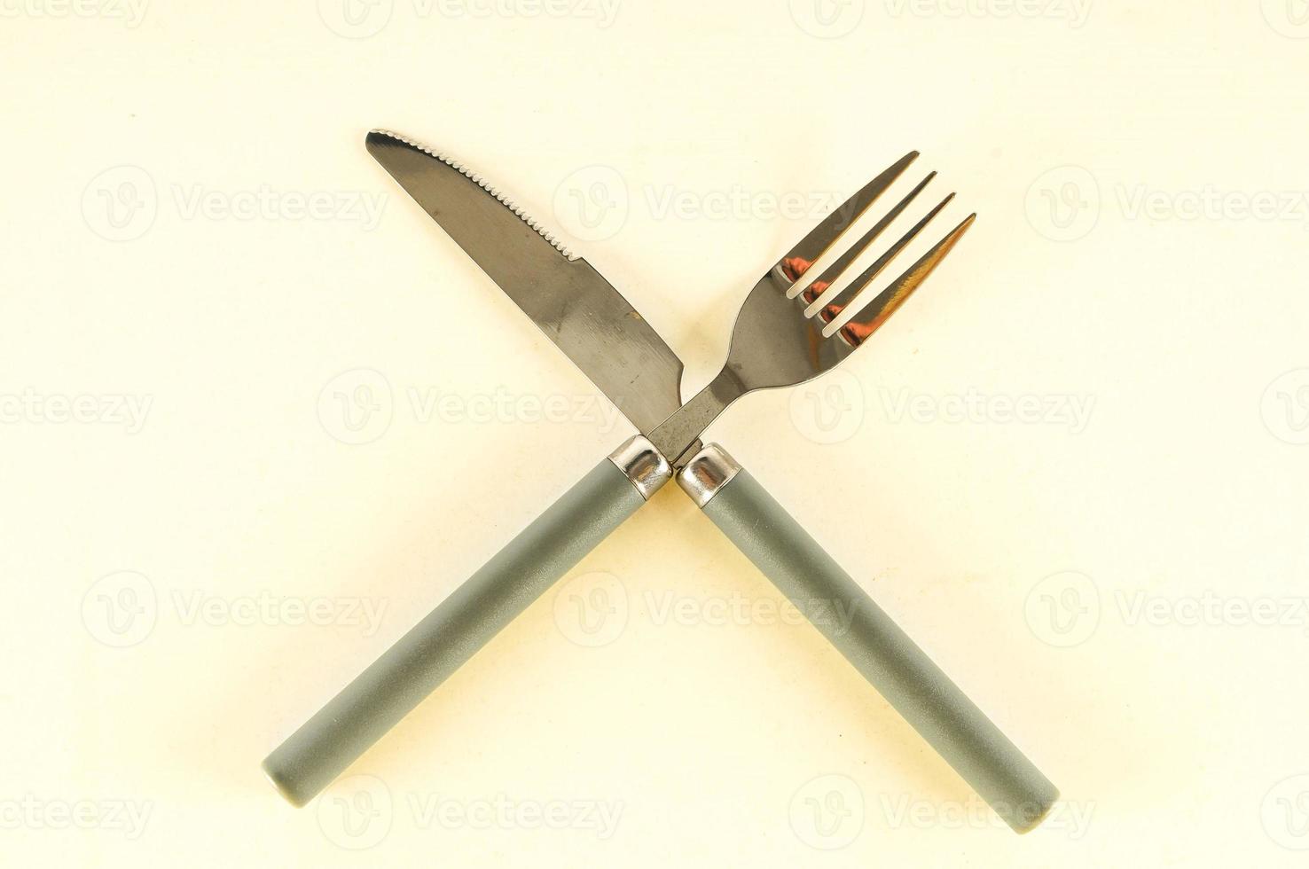 Metal cutlery on light background photo