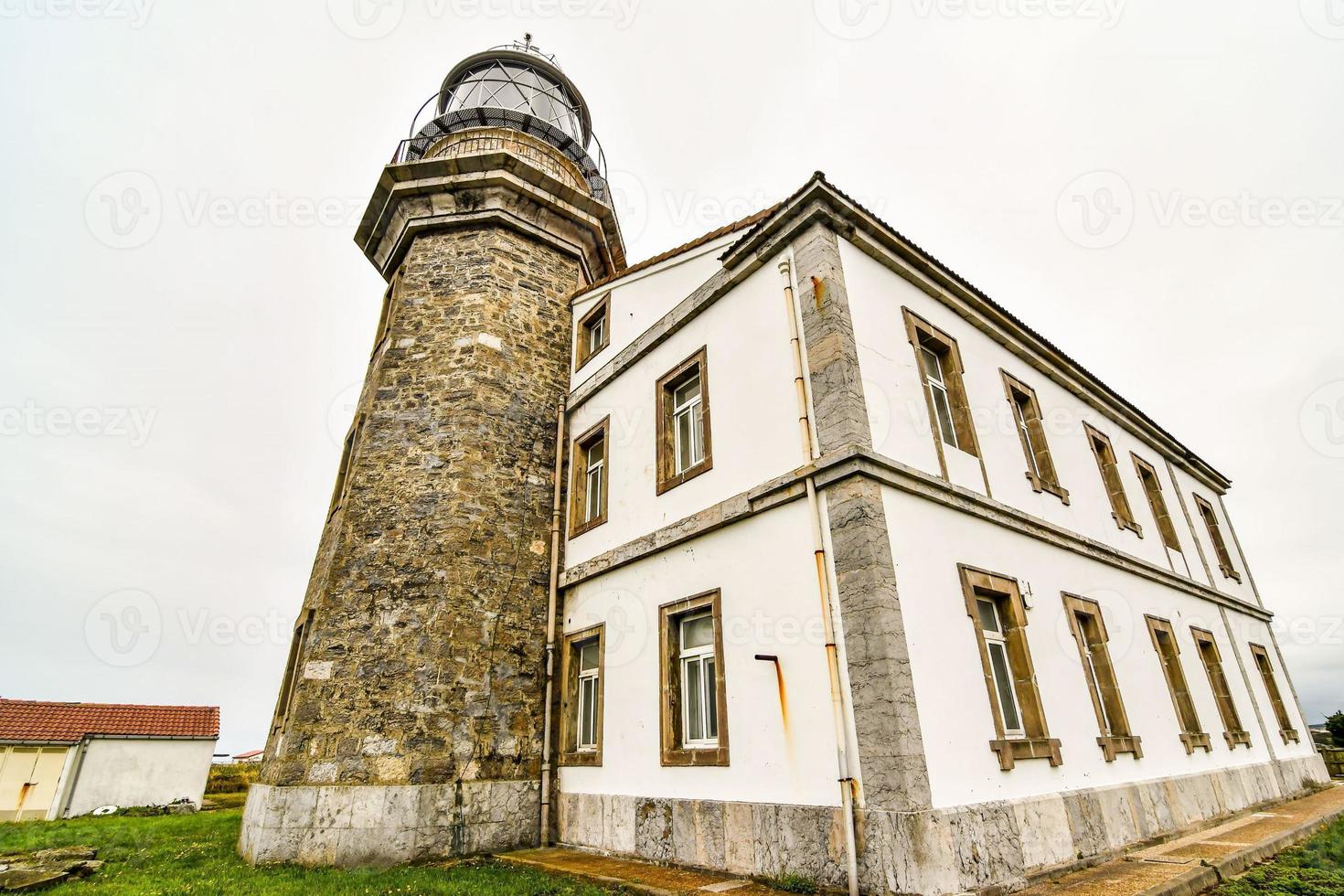 Lighthouse by the sea photo