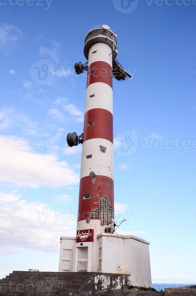 Red and White Lighthouse photo