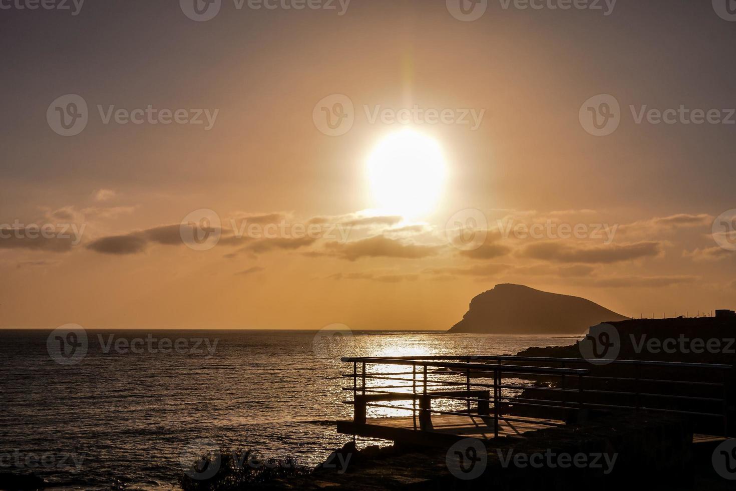 Sunset over the ocean photo