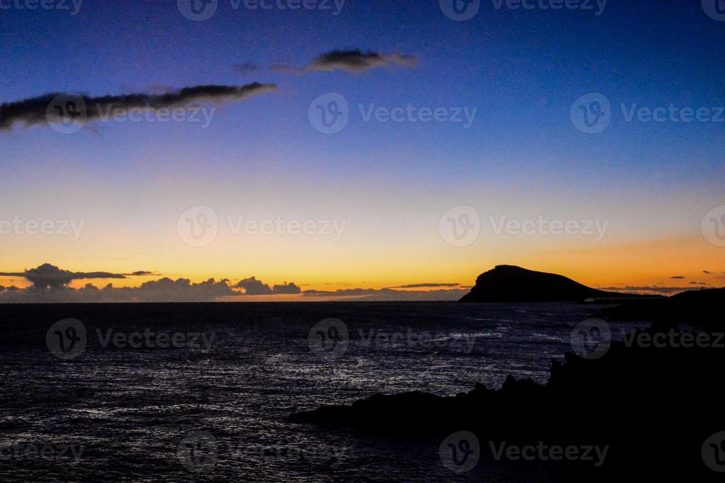 Sunset over the ocean photo