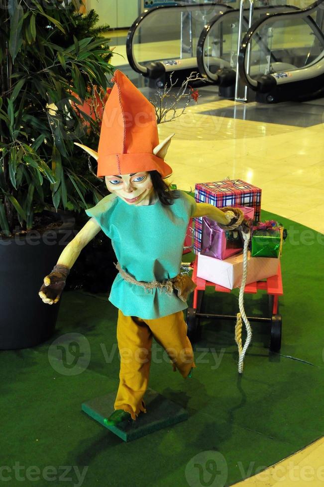 Christmas elf with gifts photo
