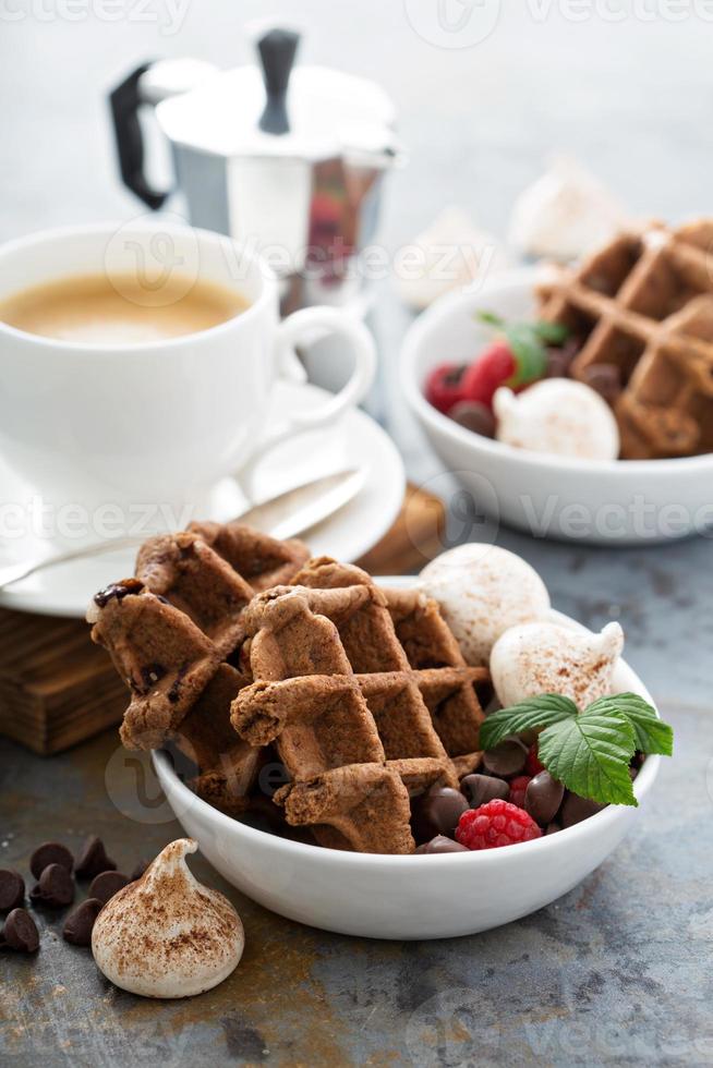 Chocolate waffles with meringues and coffee photo