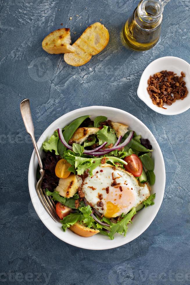 Breakfast salad with eggs and bacon photo