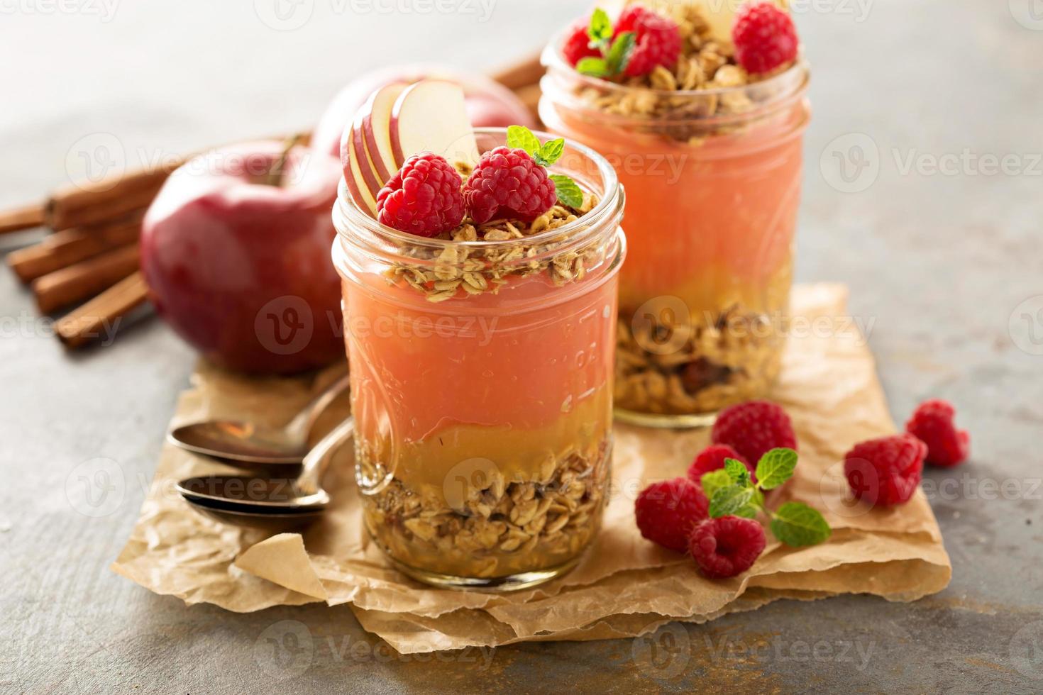 Applesauce and raspberry puree parfait with granola photo