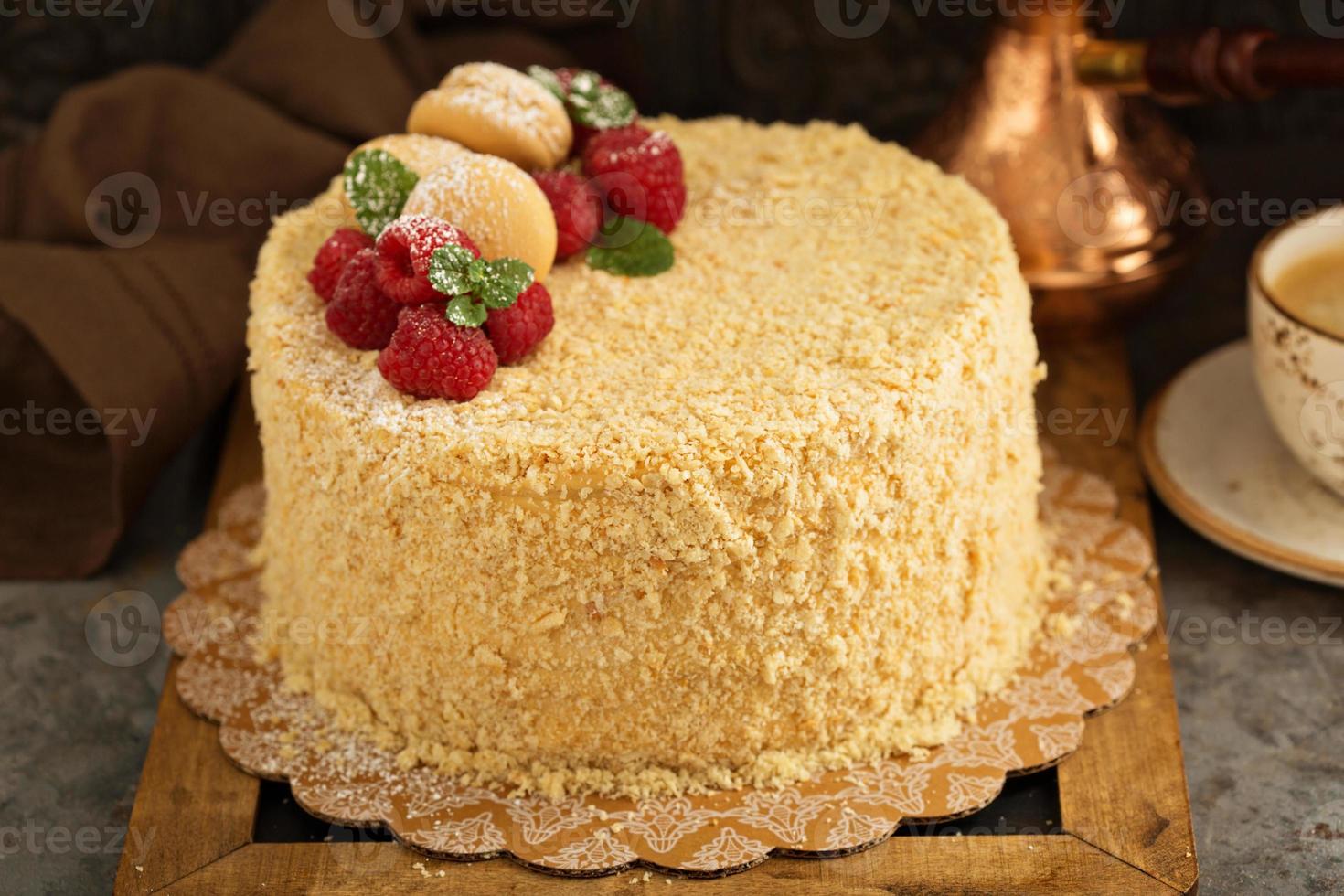 Napoleon layered cake with macarons and raspberry photo