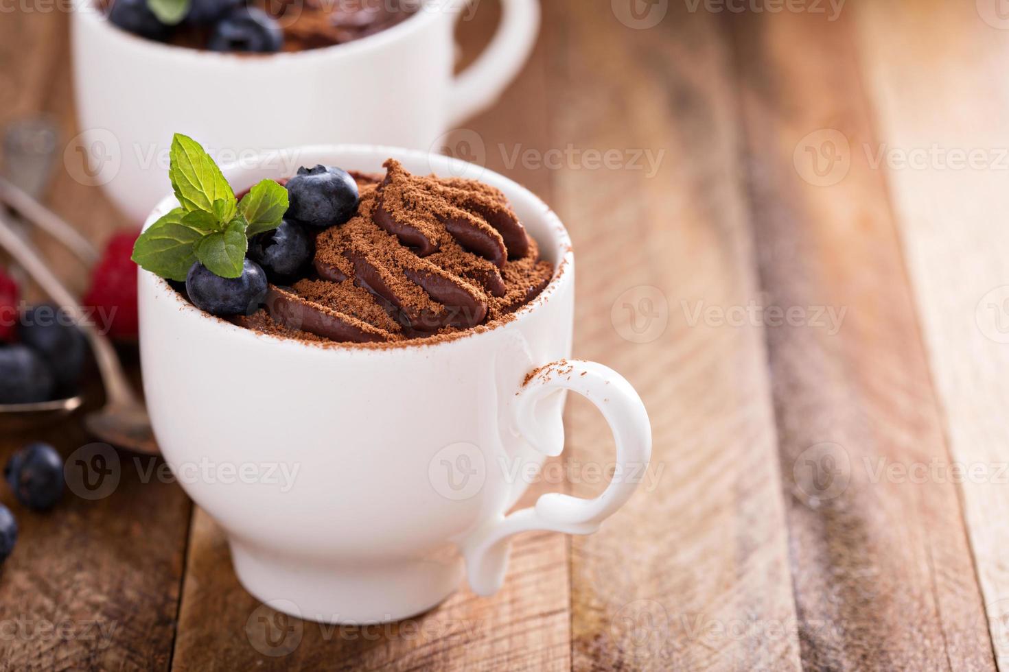 Chocolate pudding with cocoa and berries photo