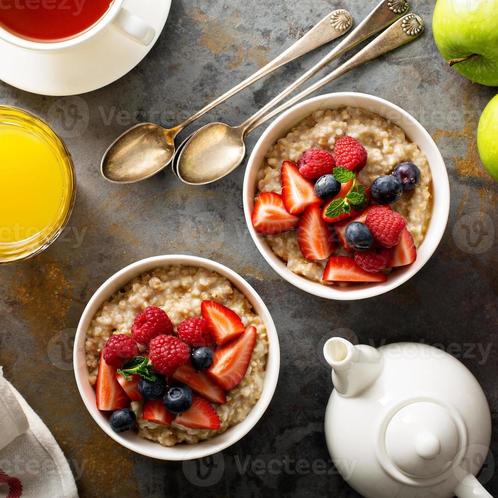Steel cut oatmeal porridge with fresh berries photo