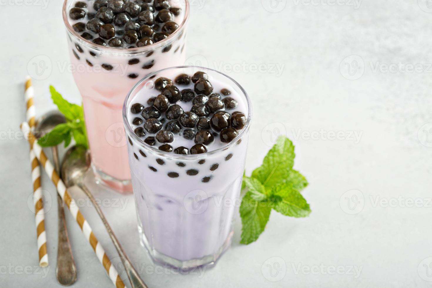 Taro and strawberry milk bubble tea in tall glasses photo