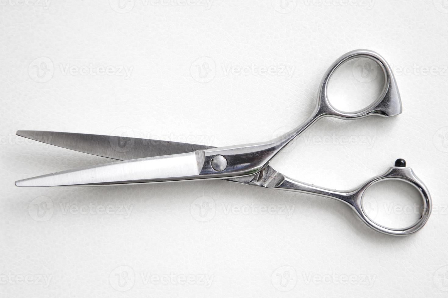 Hairdresser scissors on the white background photo