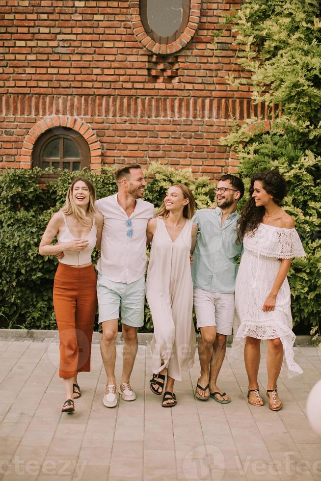 Group of happy young people having fun outdoors photo