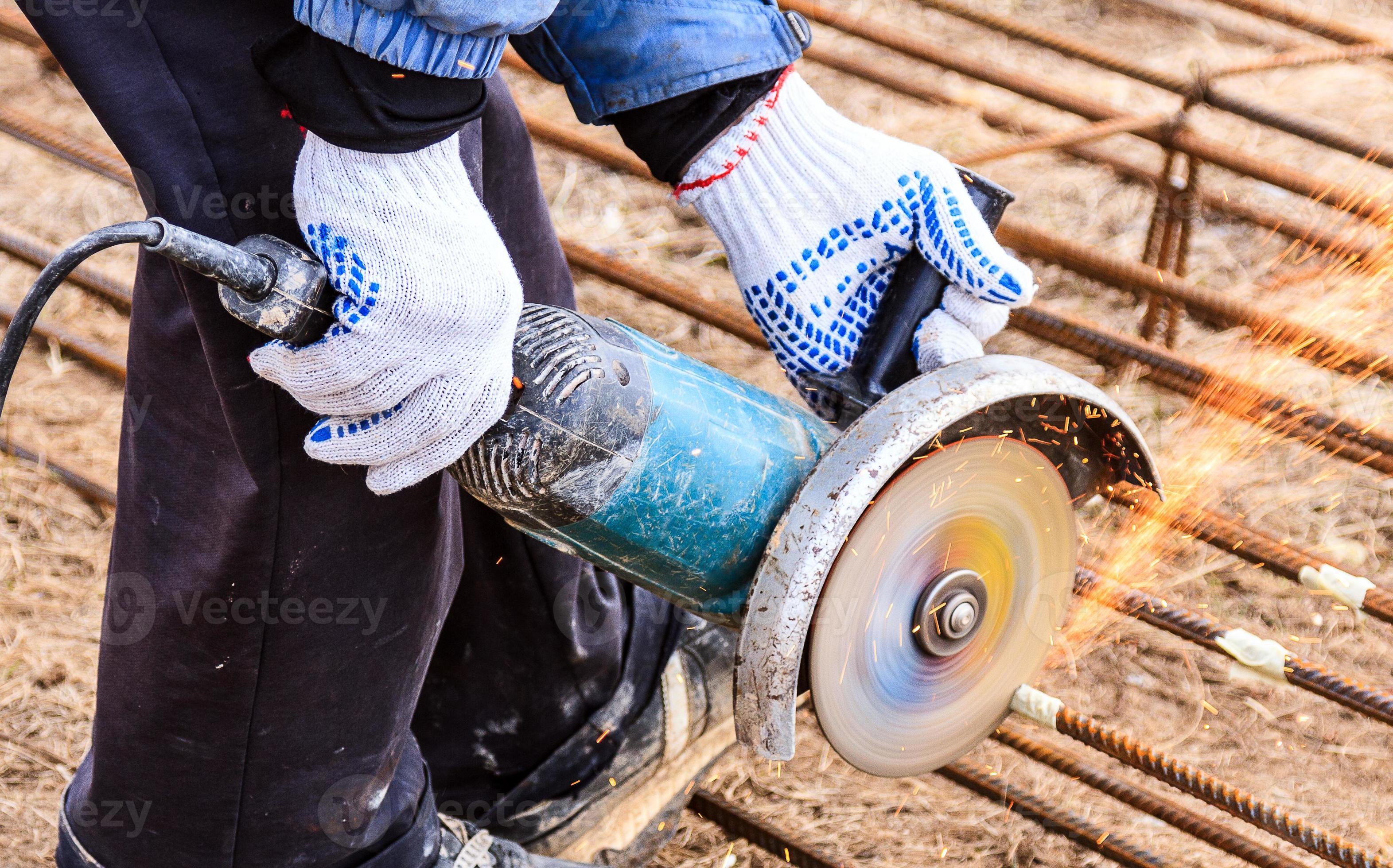 worker working on cutting a metal and steel bar with angle grinder 15743024 Stock Photo at Vecteezy