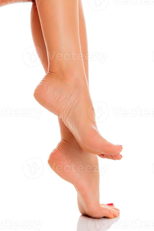 female feet on white background photo