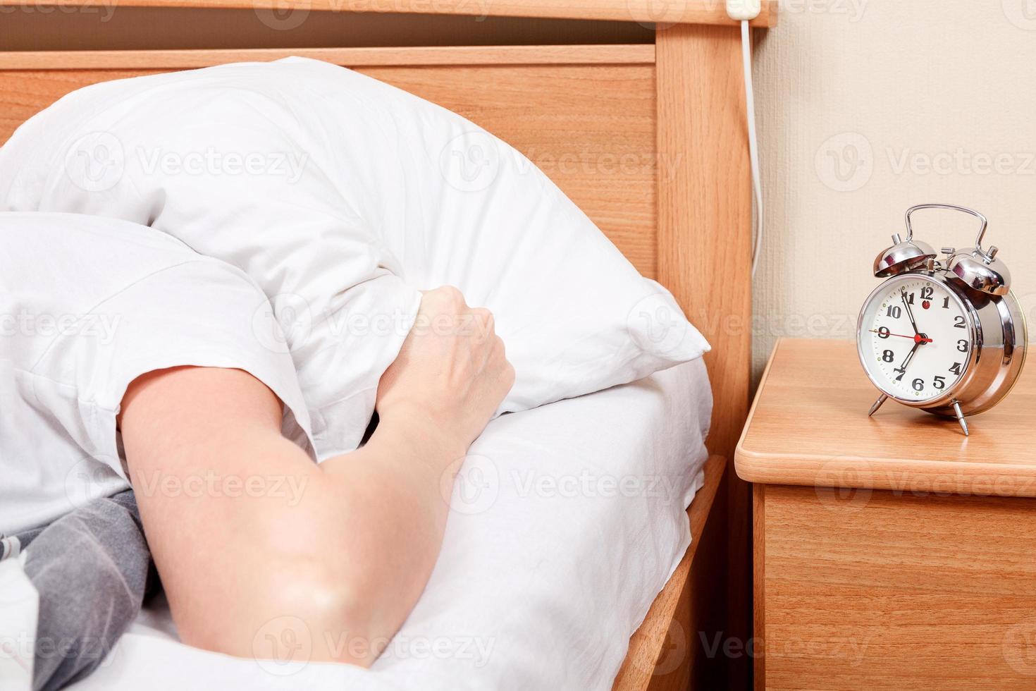 Unpleasant morning. Woman does not want to wake up photo