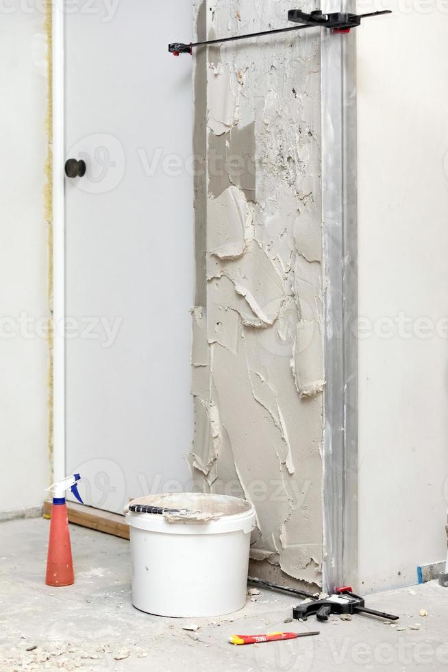 Wall with fresh plaster on it. Home apartment renovation process photo