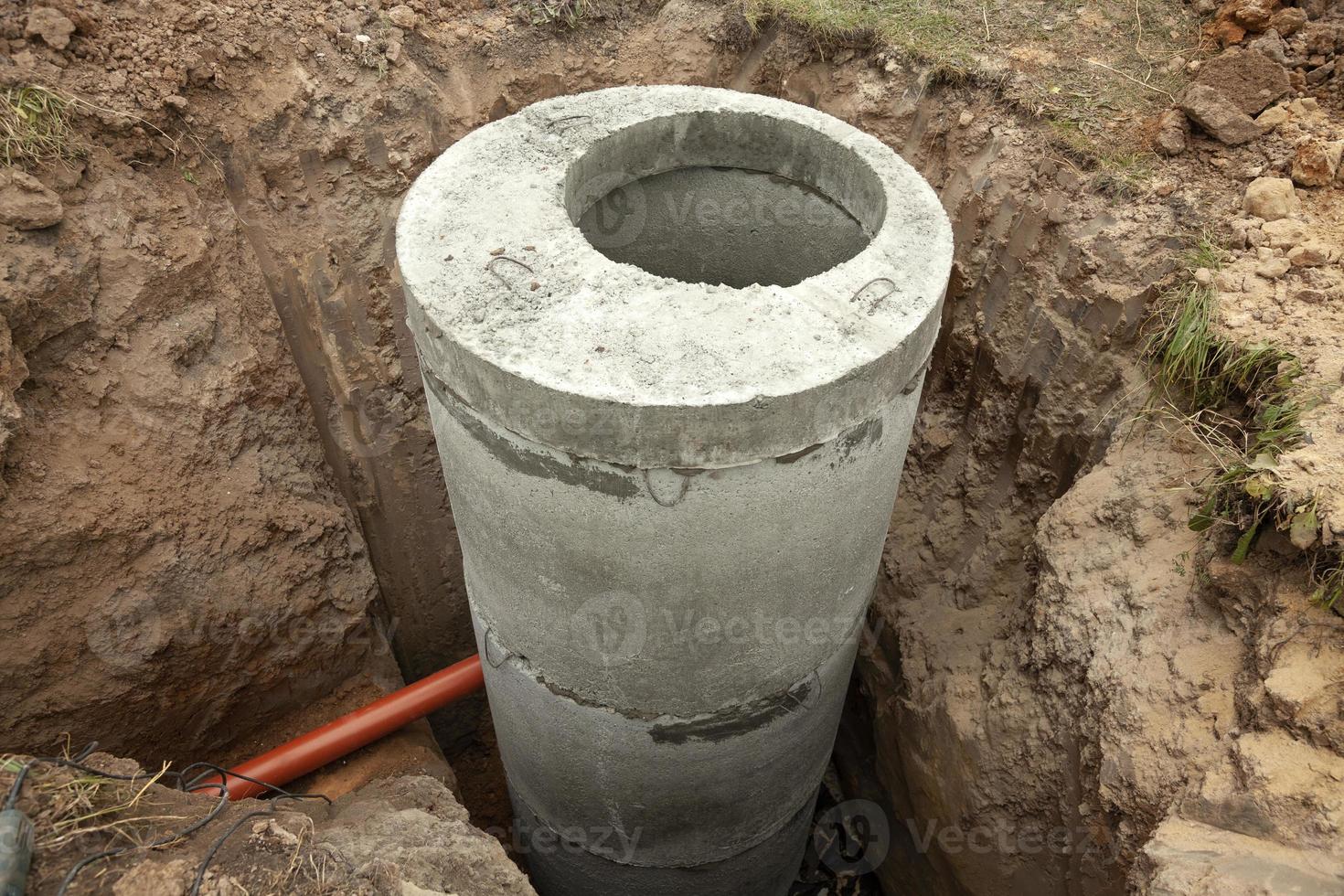 Installation of underground tank for sewage system photo