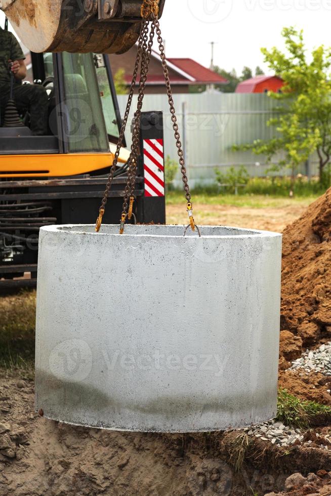 Installation of underground tank for sewage system photo